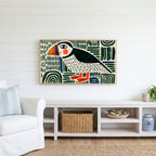 Folk art puffin Frame TV art above a white console with a rattan basket in a coastal living room