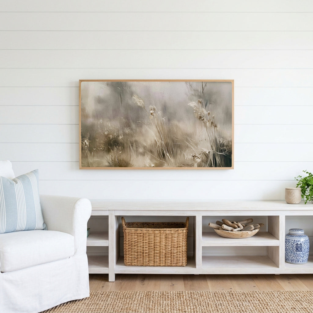 Misty meadow Frame TV art above a white console with a rattan basket in a coastal living room