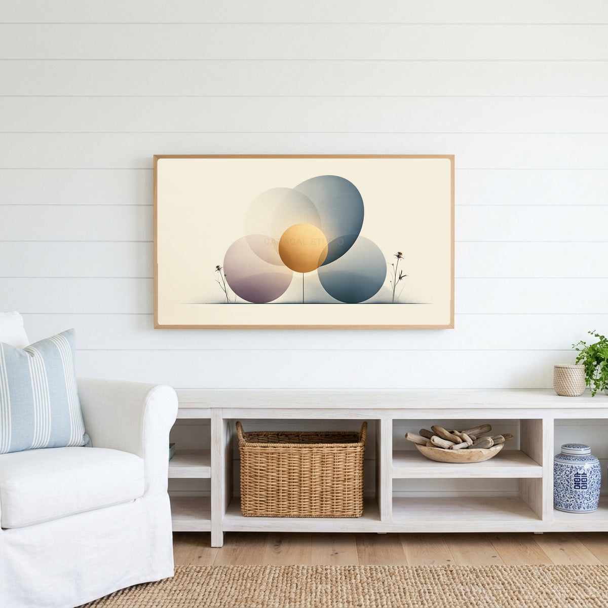 Abstract circles Frame TV art above a white console with a rattan basket in a coastal living room