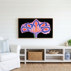 Surreal flower Frame TV art above a white console with a rattan basket in a coastal living room