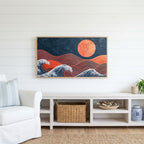 Japanese waves and sun Frame TV art above a white console with a rattan basket in a coastal living room