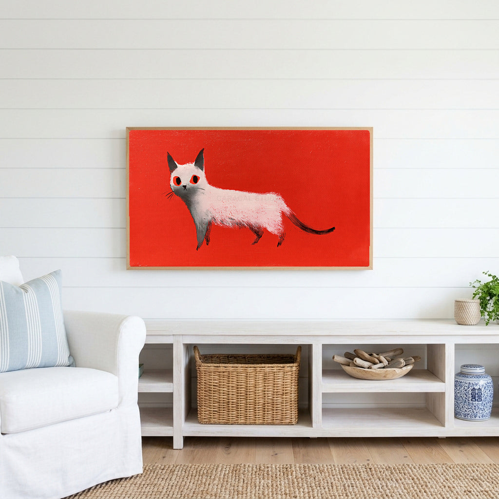White cat Frame TV art above a white console with a rattan basket in a coastal living room