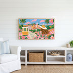 Lisbon tram Frame TV art above a white console with a rattan basket in a coastal living room