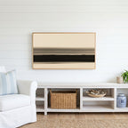 Ink wash horizon Frame TV art above a white console with a rattan basket in a coastal living room