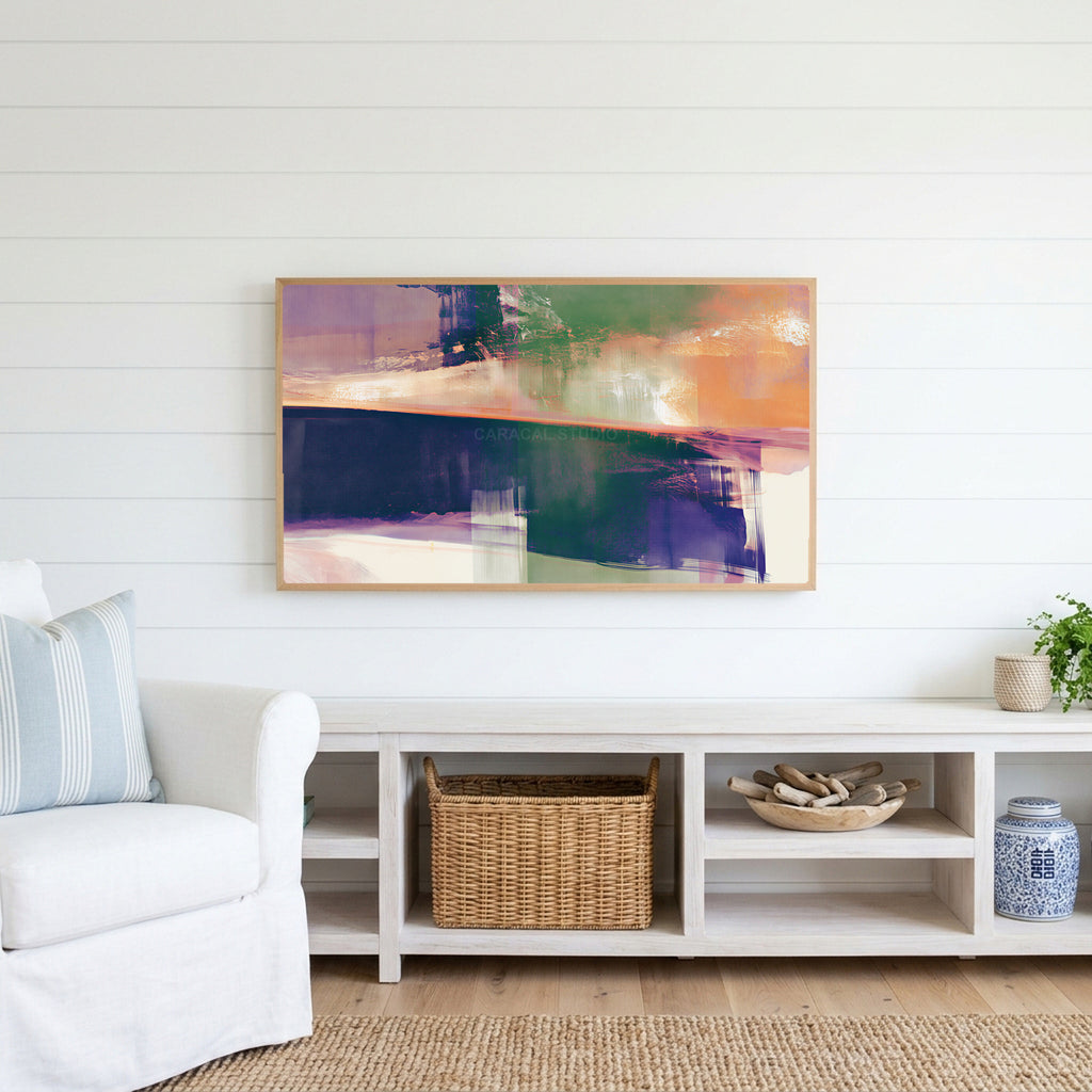 Abstract brushstroke Frame TV art above a white console with a rattan basket in a coastal living room