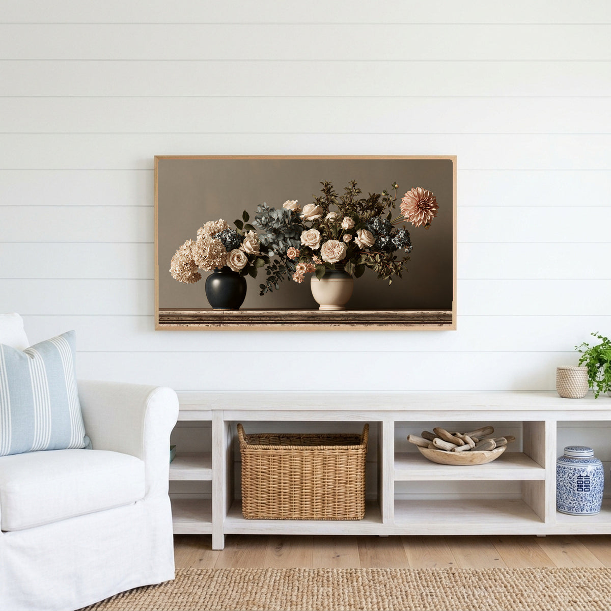 Roses and hydrangeas still life Frame TV art above a white console with a rattan basket in a coastal living room