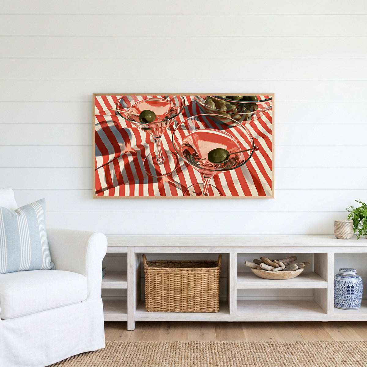 Martini cocktails Frame TV art above a white console with a rattan basket in a coastal living room