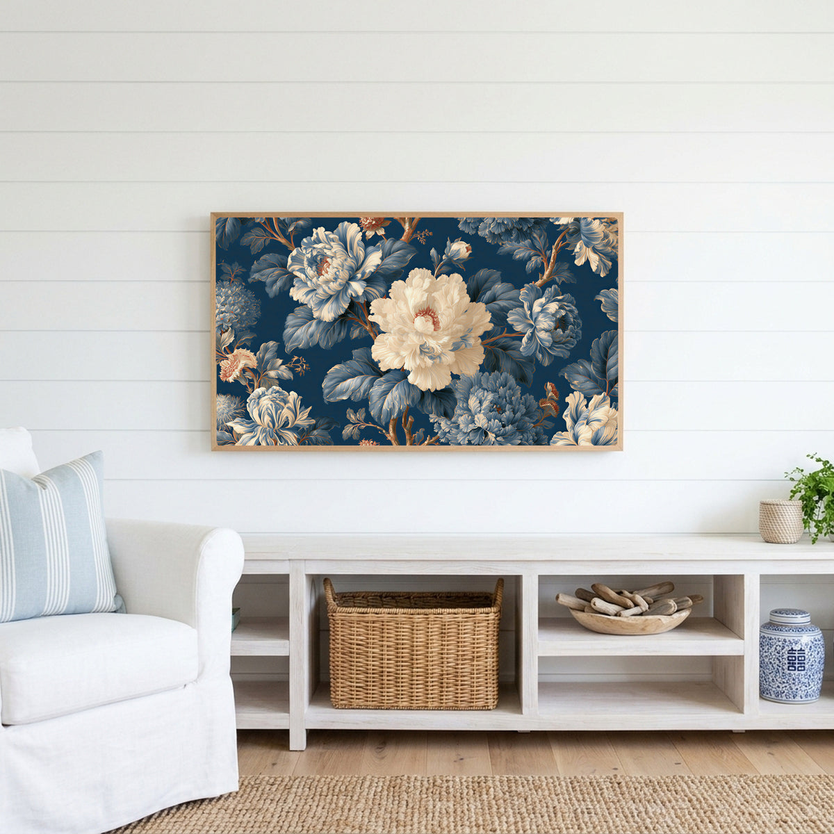 Blue and cream peonies Frame TV art above a white console with a rattan basket in a coastal living room