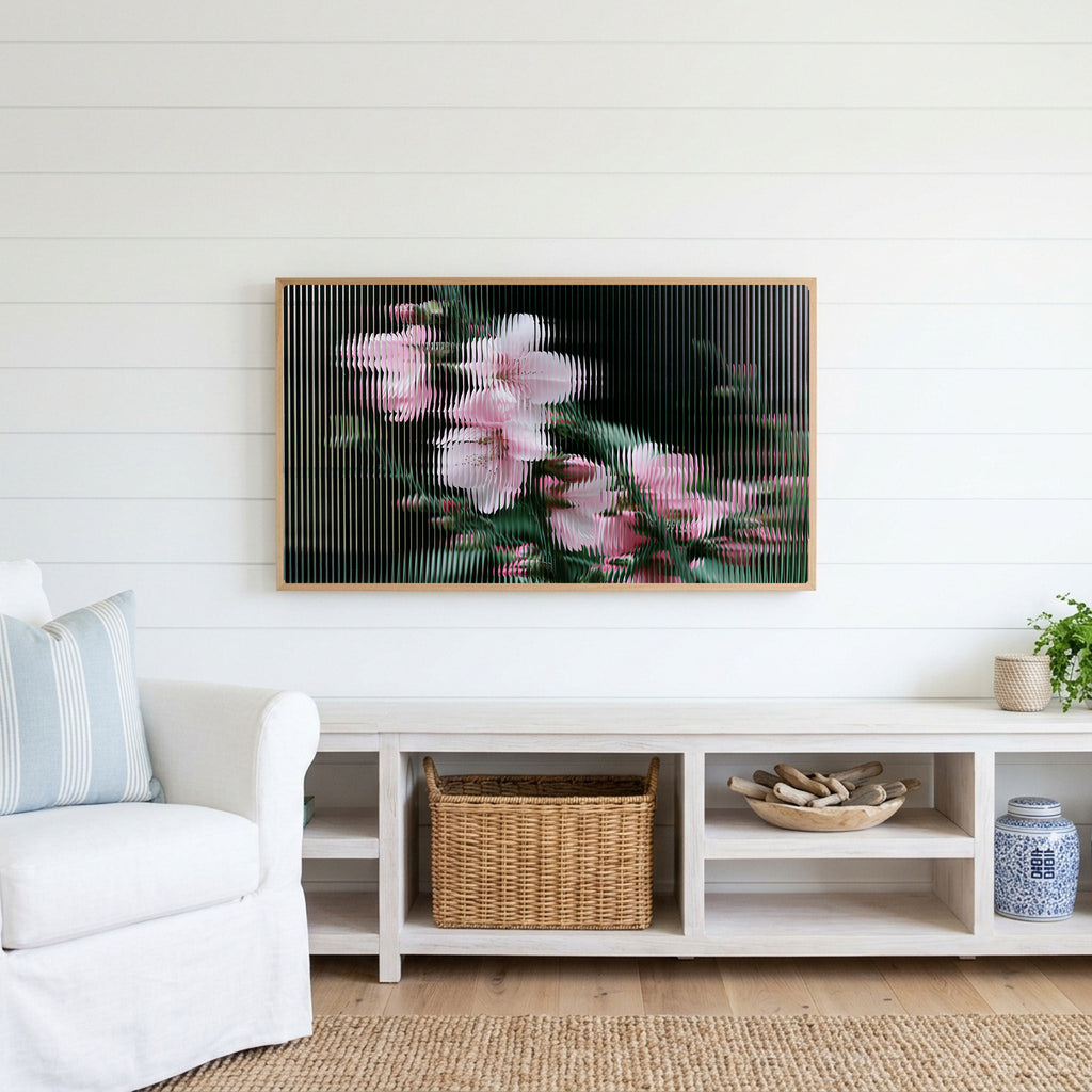 Fluted glass blossom Frame TV art above a white console with a rattan basket in a coastal living room