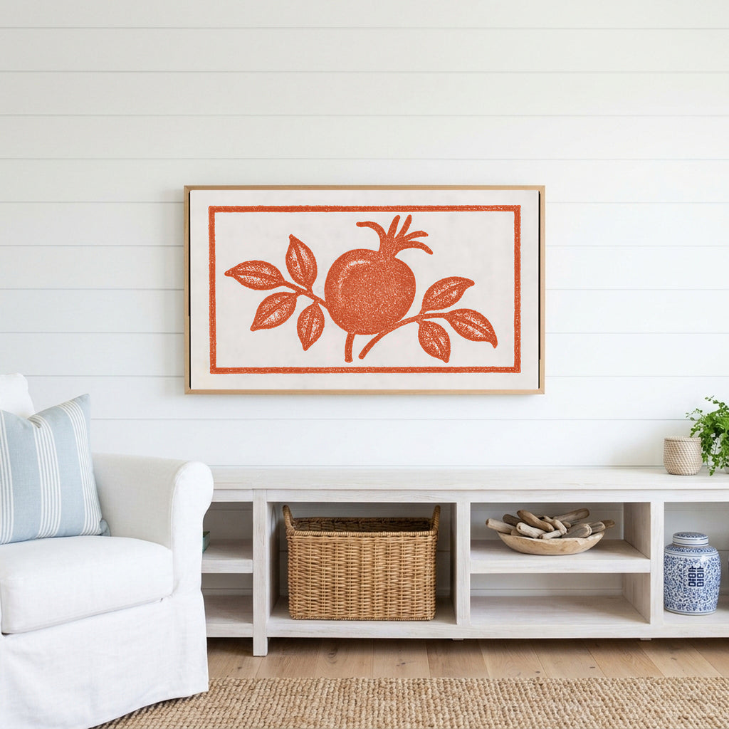 Pomegranate linocut Frame TV art above a white console with a rattan basket in a coastal living room