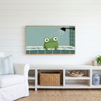 Frog in the shower Frame TV art above a white console with a rattan basket in a coastal living room