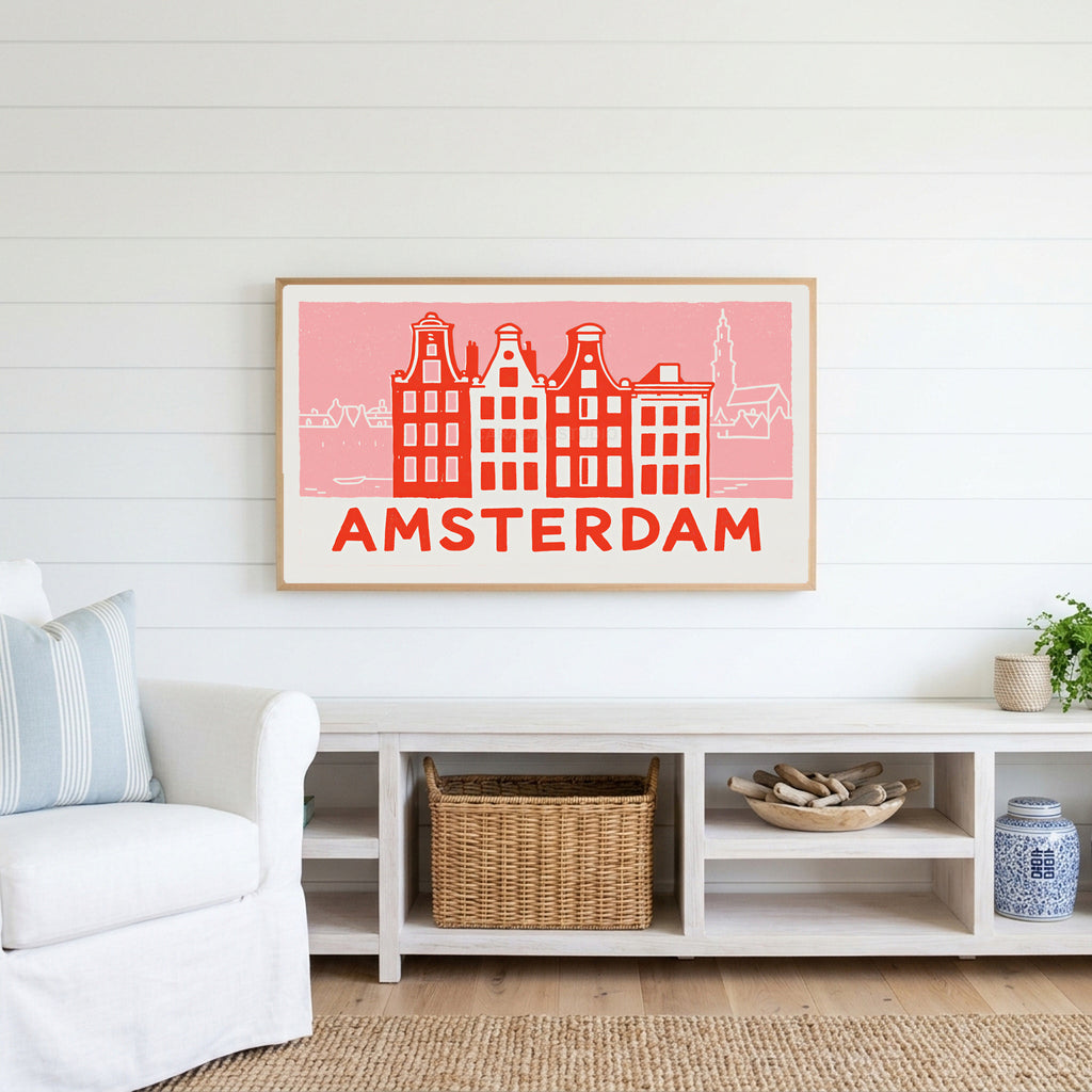 Amsterdam canal houses Frame TV art above a white console with a rattan basket in a coastal living room
