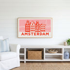 Amsterdam canal houses Frame TV art above a white console with a rattan basket in a coastal living room