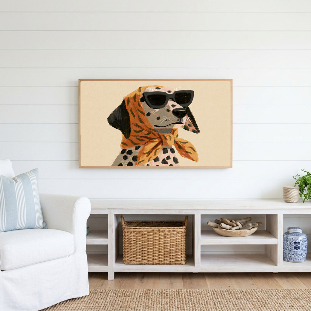 Dalmatian in sunglasses Frame TV art above a white console with a rattan basket in a coastal living room