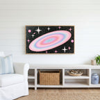Pastel galaxy Frame TV art above a white console with a rattan basket in a coastal living room