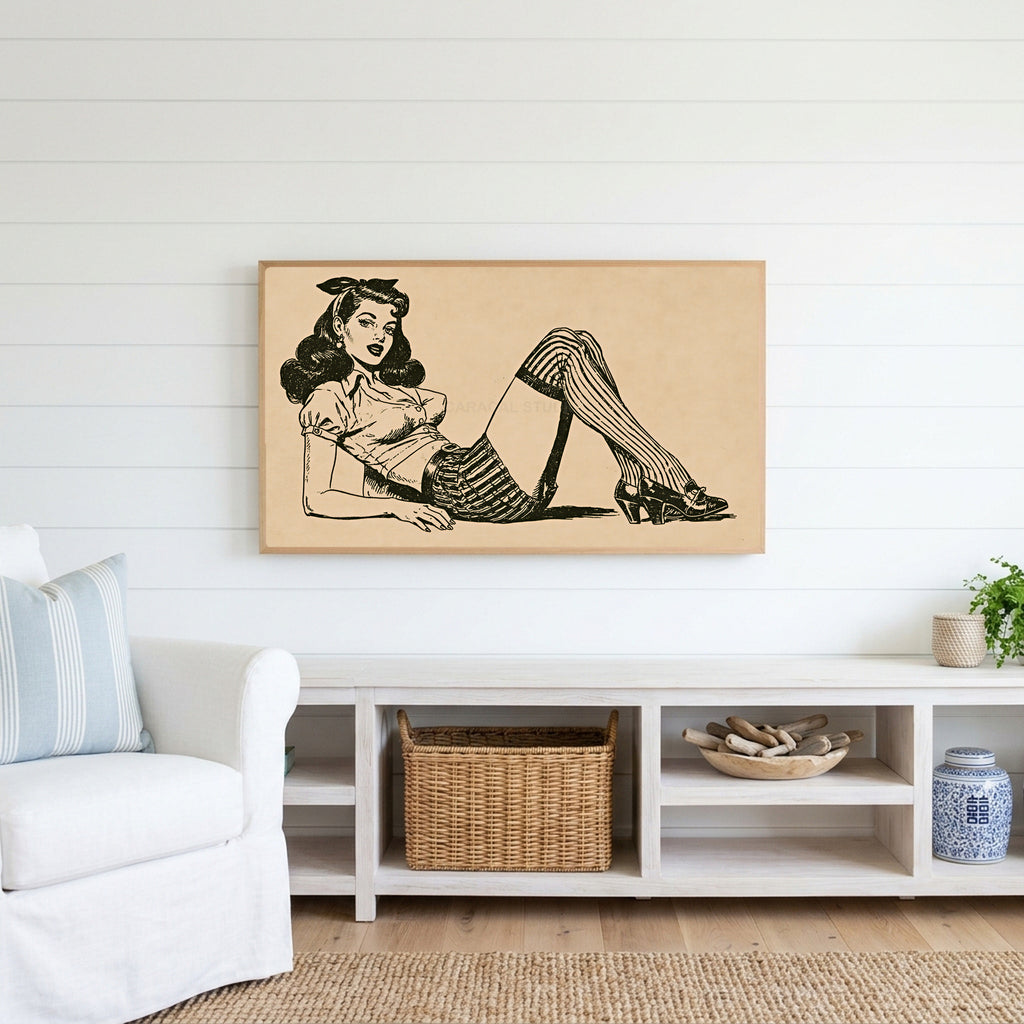 Vintage pin-up drawing Frame TV art above a white console with a rattan basket in a coastal living room