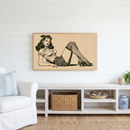 Vintage pin-up drawing Frame TV art above a white console with a rattan basket in a coastal living room