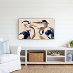 Blue heron Frame TV art above a white console with a rattan basket in a coastal living room