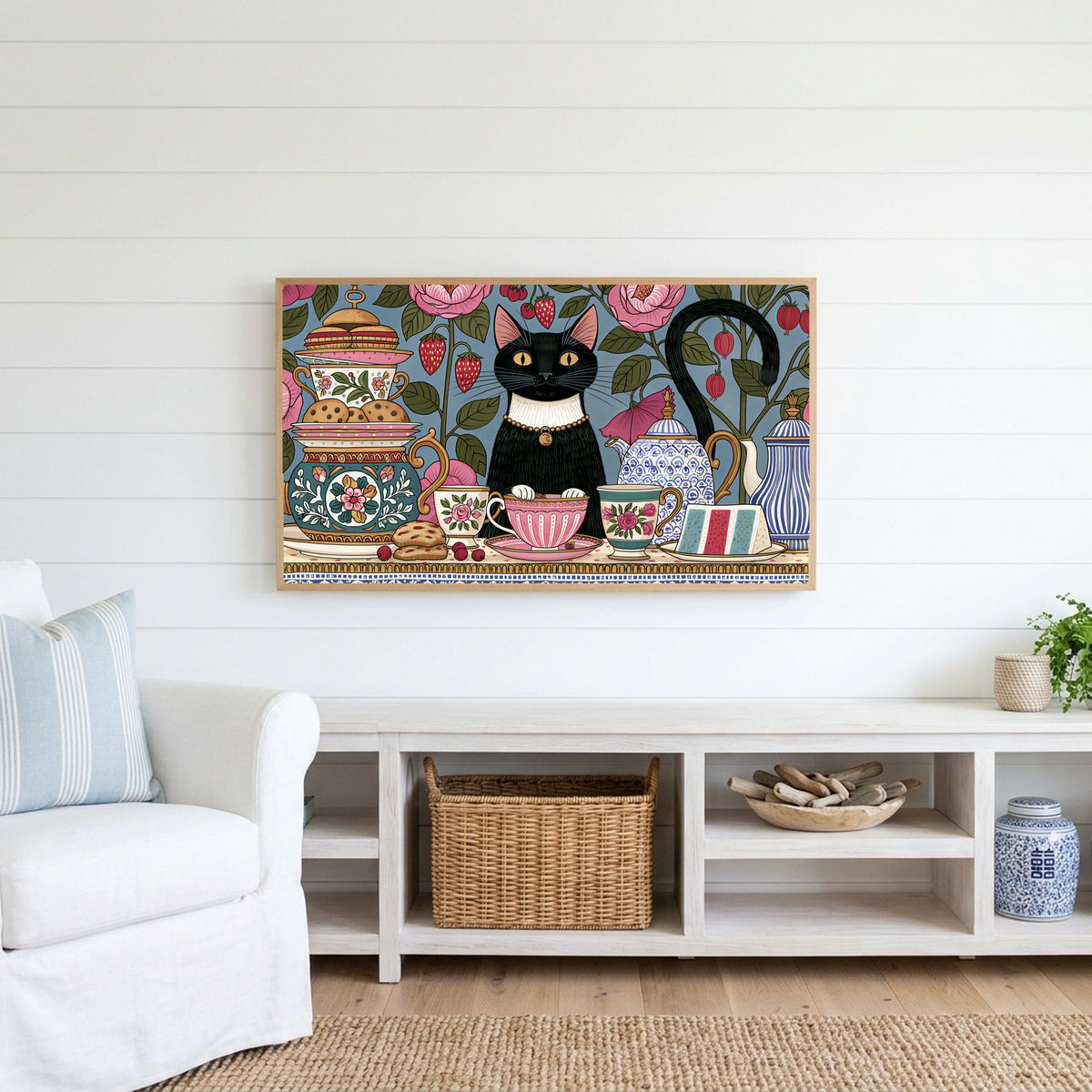 Black cat at a tea party Frame TV art above a white console with a rattan basket in a coastal living room