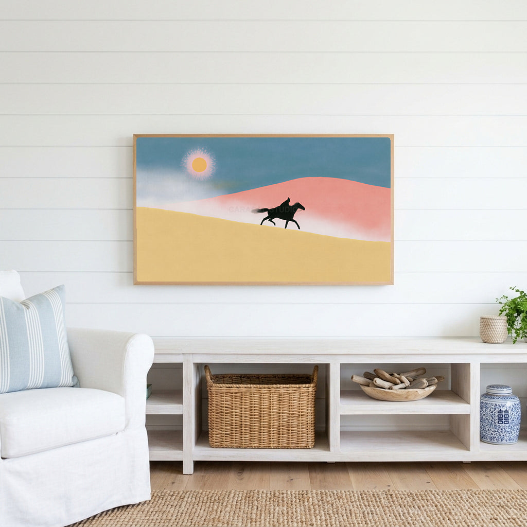 Rider in the desert Frame TV art above a white console with a rattan basket in a coastal living room