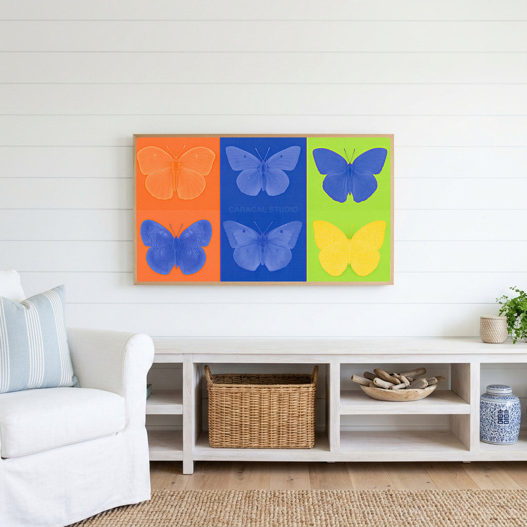 Pop art butterfly Frame TV art above a white console with a rattan basket in a coastal living room