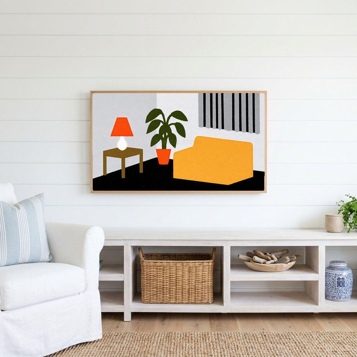 Mid century room Frame TV art above a white console with a rattan basket in a coastal living room