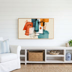Cubist faces Frame TV art above a white console with a rattan basket in a coastal living room