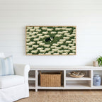 Border collie and sheep Frame TV art above a white console with a rattan basket in a coastal living room