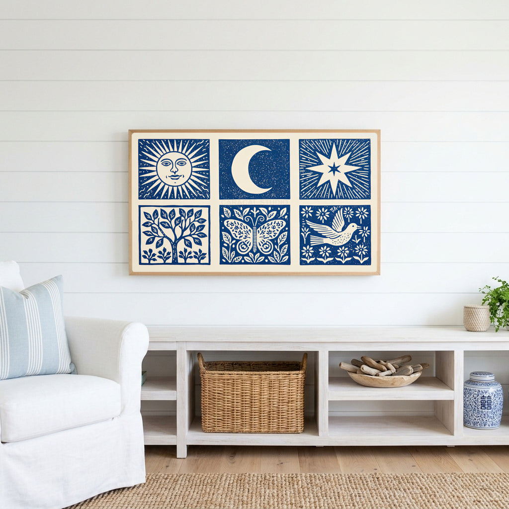 Celestial folk Frame TV art above a white console with a rattan basket in a coastal living room