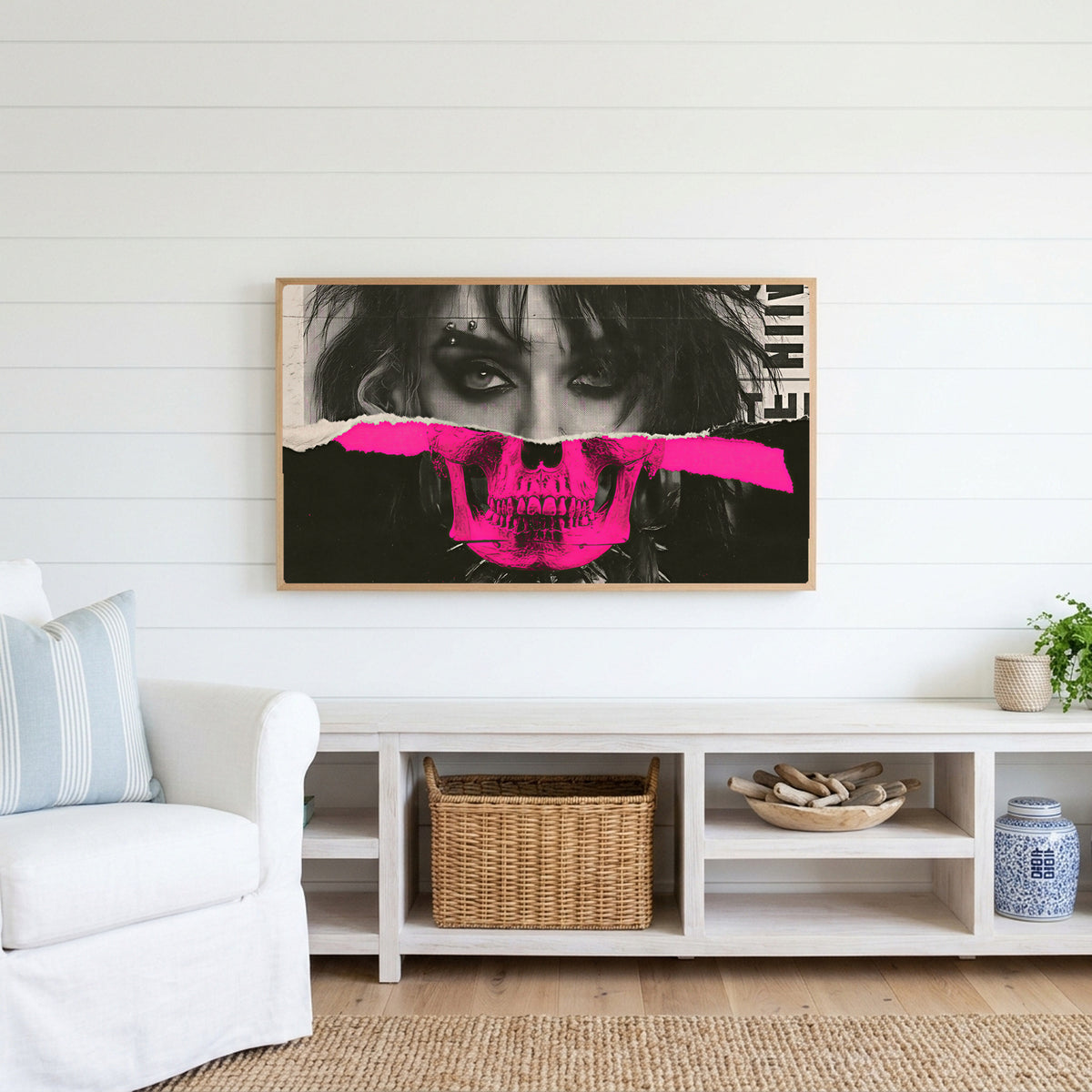 Punk skull portrait Frame TV art above a white console with a rattan basket in a coastal living room