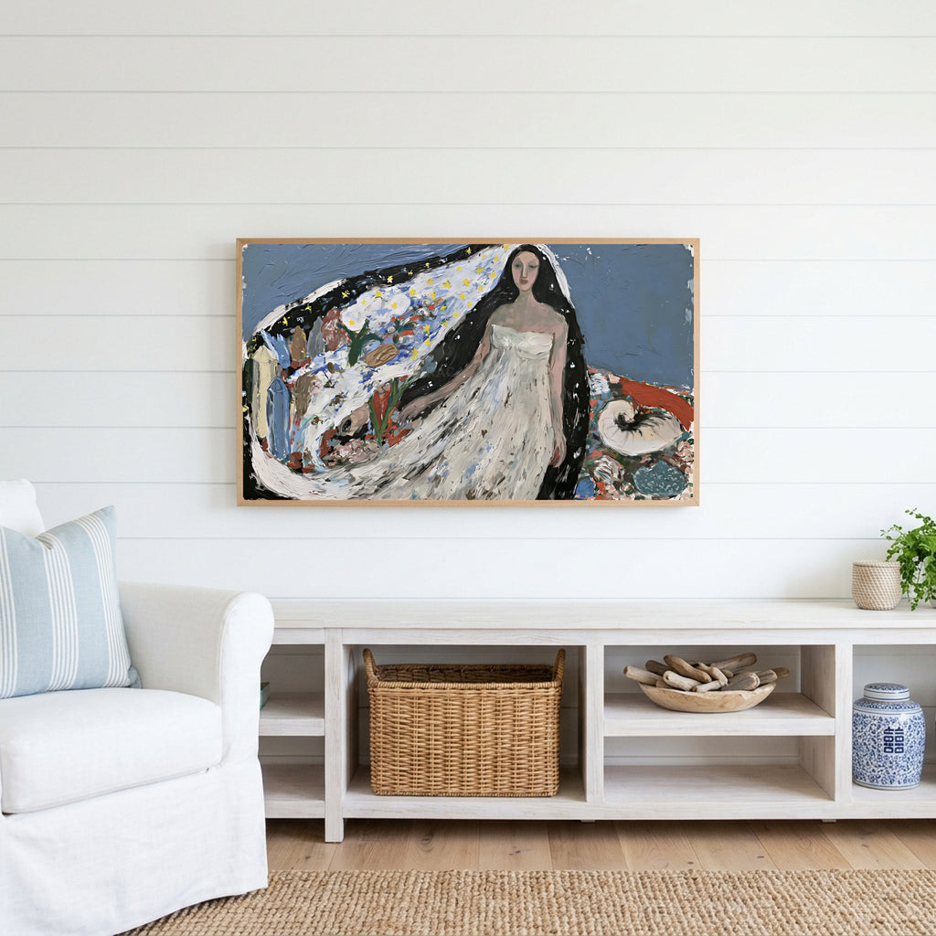Starry veil woman Frame TV art above a white console with a rattan basket in a coastal living room