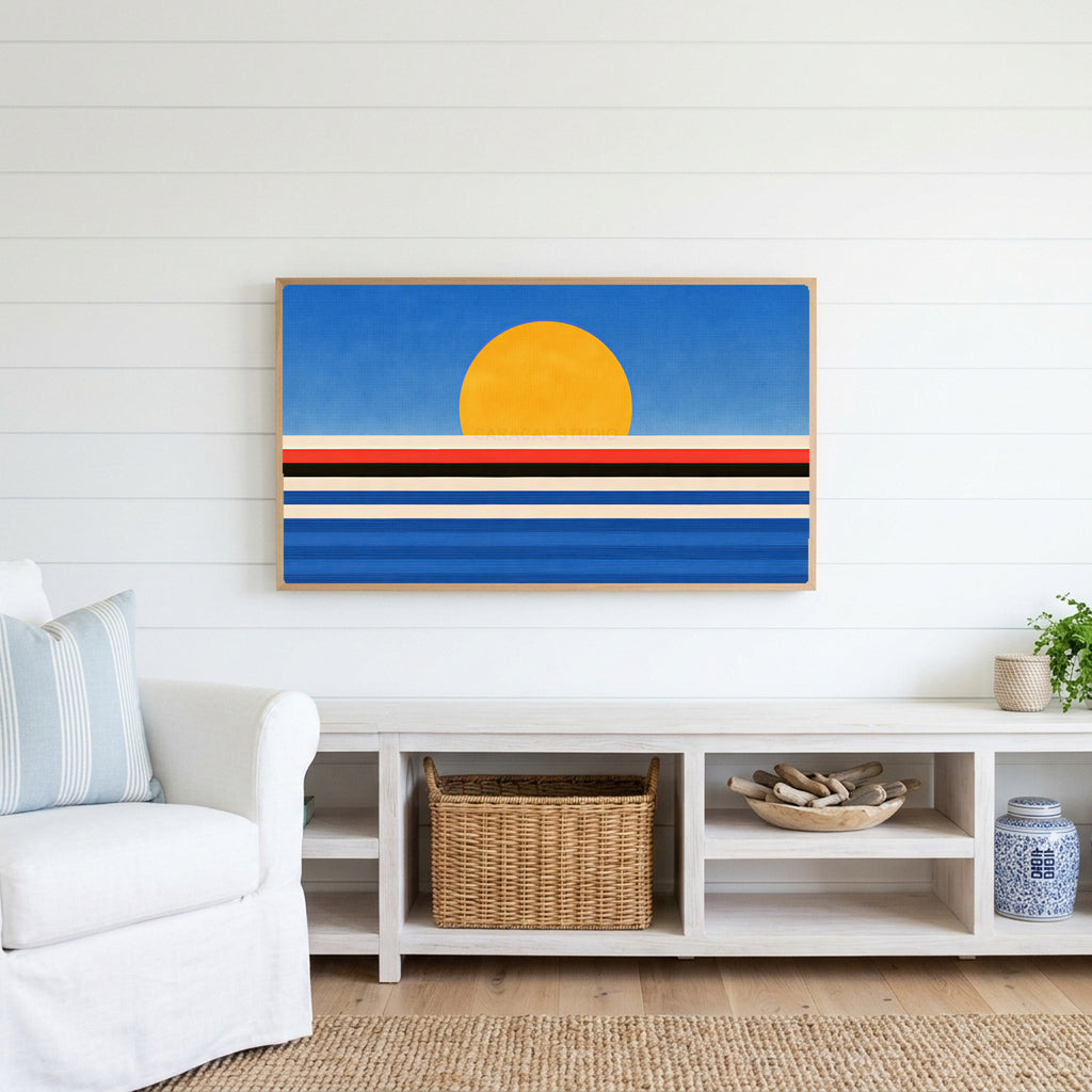 Retro sunset over the sea Frame TV art above a white console with a rattan basket in a coastal living room