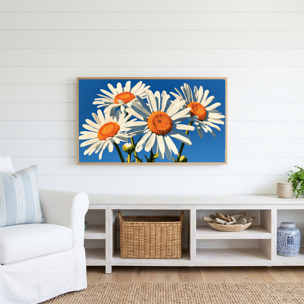 Daisy Frame TV art above a white console with a rattan basket in a coastal living room