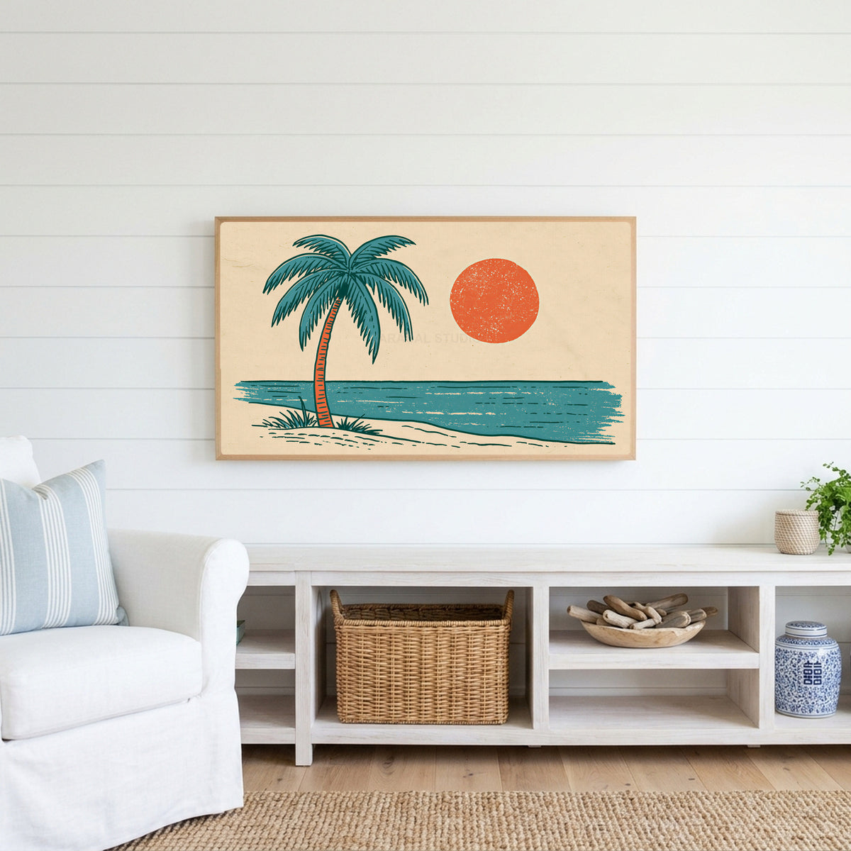 Retro palm tree Frame TV art above a white console with a rattan basket in a coastal living room