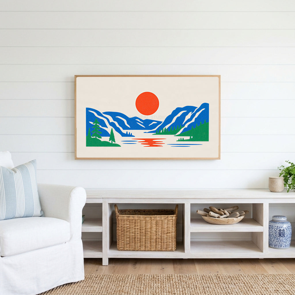 Mountain lake sun Frame TV art above a white console with a rattan basket in a coastal living room