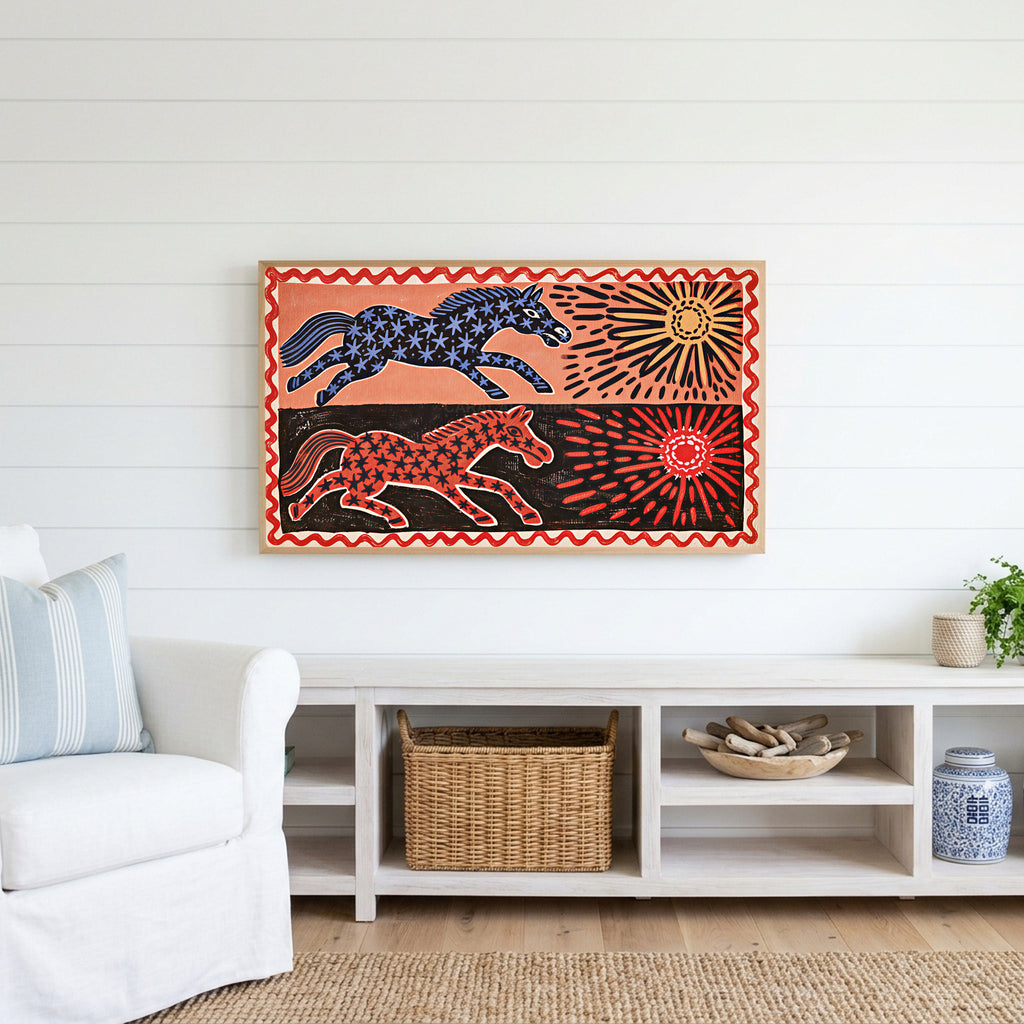 Folk star horses Frame TV art above a white console with a rattan basket in a coastal living room