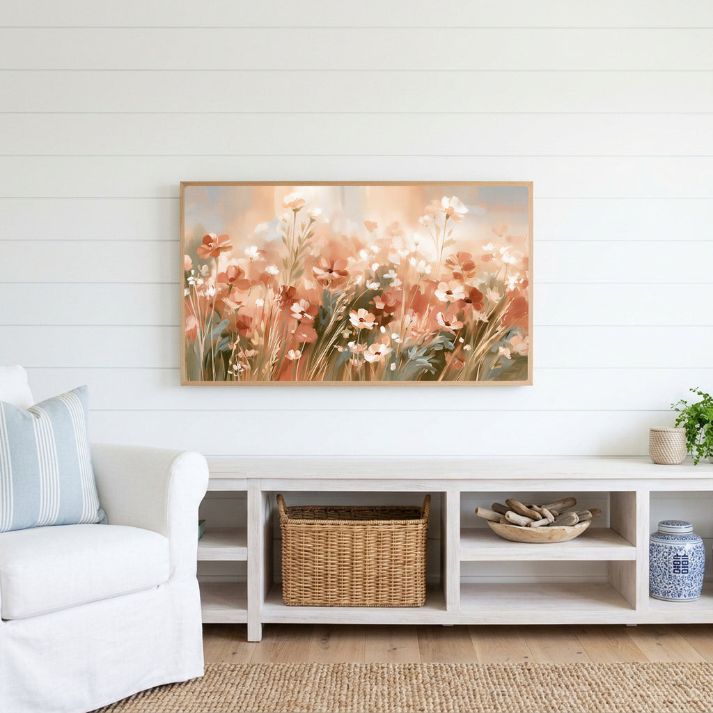 Terracotta wildflower meadow Frame TV art above a white console with a rattan basket in a coastal living room
