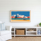 Mediterranean village Frame TV art above a white console with a rattan basket in a coastal living room