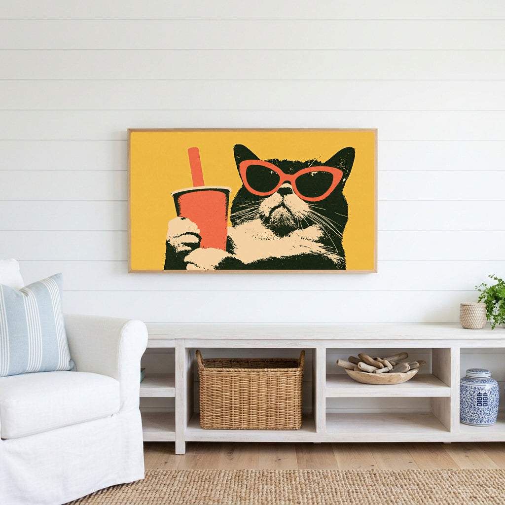 Funny cat in sunglasses Frame TV art above a white console with a rattan basket in a coastal living room