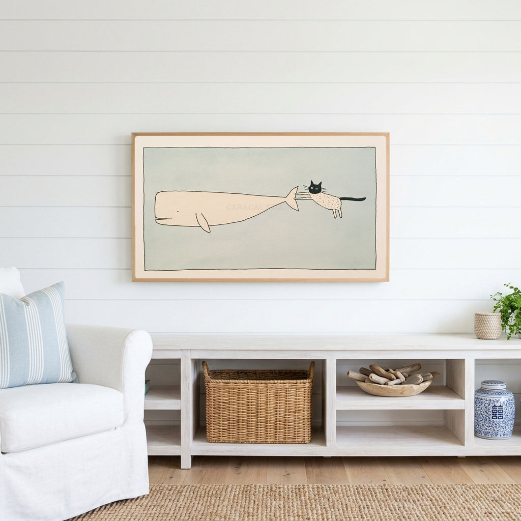 Cat and whale Frame TV art above a white console with a rattan basket in a coastal living room