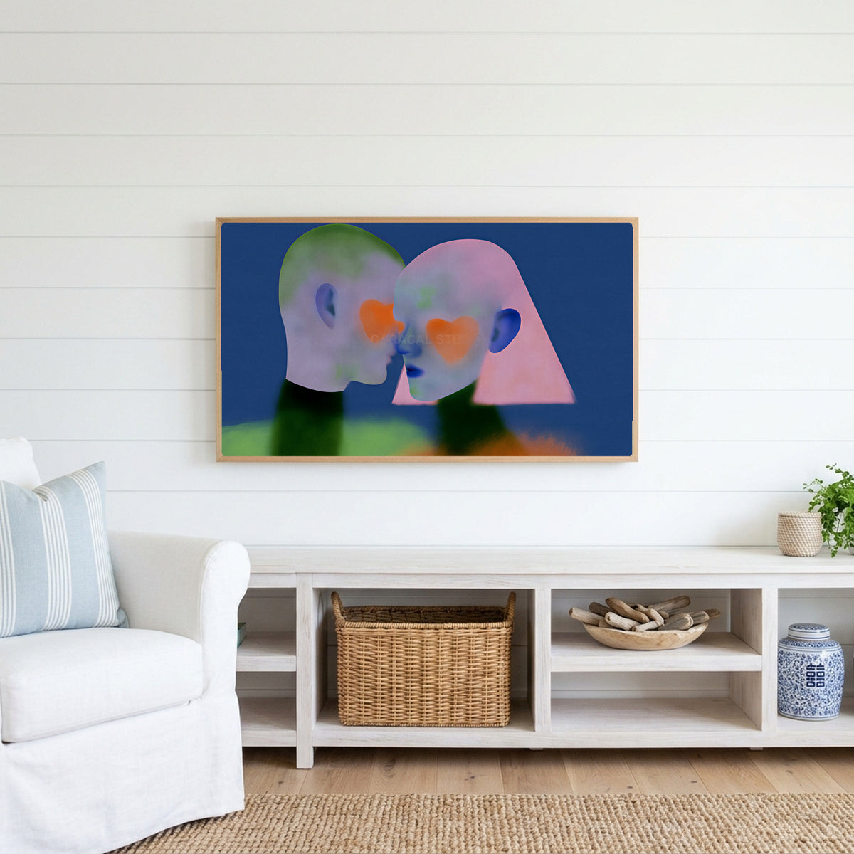 Heart cheek portrait Frame TV art above a white console with a rattan basket in a coastal living room