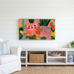Spotted cat Frame TV art above a white console with a rattan basket in a coastal living room