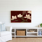 Cream blossoms on burgundy Frame TV art above a white console with a rattan basket in a coastal living room