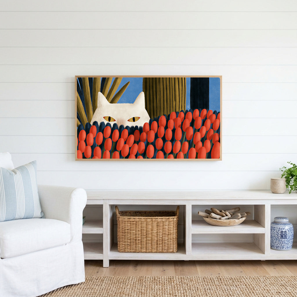 White cat and red tulips Frame TV art above a white console with a rattan basket in a coastal living room