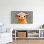 Grumpy lamb Frame TV art above a white console with a rattan basket in a coastal living room