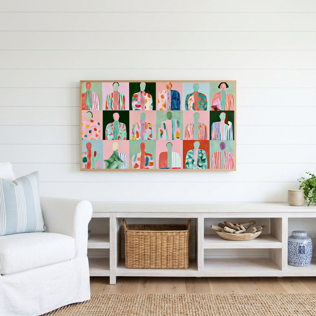 Faceless portraits Frame TV art above a white console with a rattan basket in a coastal living room