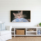Space cat Frame TV art above a white console with a rattan basket in a coastal living room