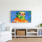 Parrot in a sweater Frame TV art above a white console with a rattan basket in a coastal living room