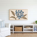 Striped tulip Frame TV art above a white console with a rattan basket in a coastal living room
