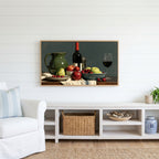 Wine and fruit still life Frame TV art above a white console with a rattan basket in a coastal living room